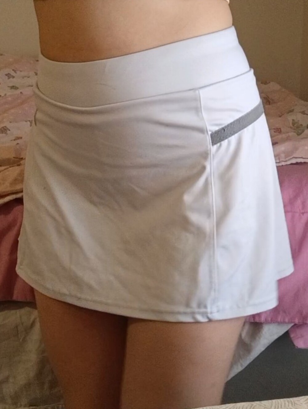 Sleek white exercise skirt with built in shorts